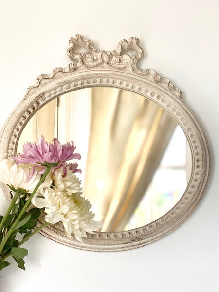 Frame in landscape oval from The Unfurling with delicate ribbon