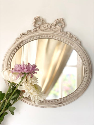 Frame in landscape oval from The Unfurling with delicate ribbon
