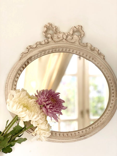 Frame in landscape oval from The Unfurling with delicate ribbon