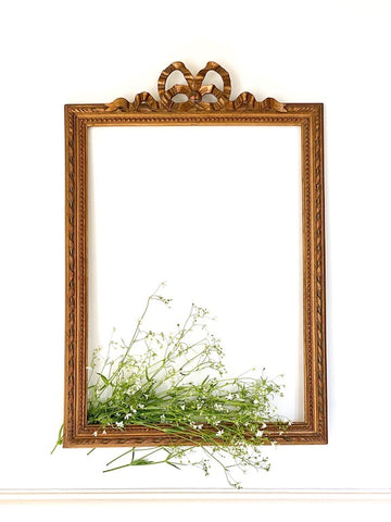 Frame from The Unfurling with delicate ribbon