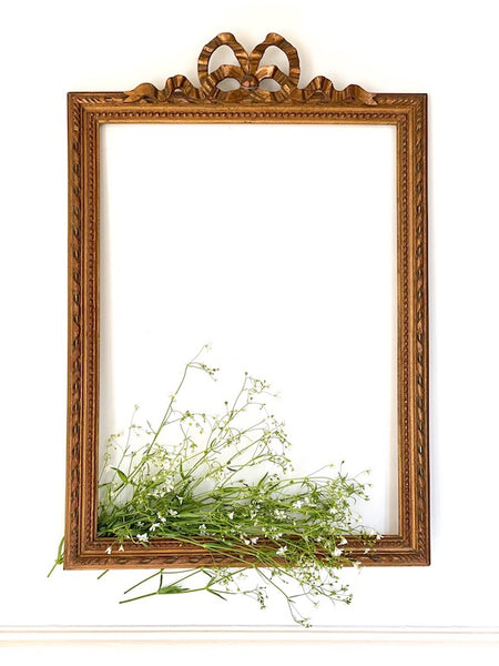 Frame from The Unfurling with delicate ribbon