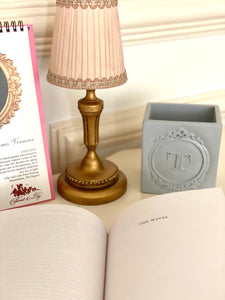 Pencil holders with tympanum