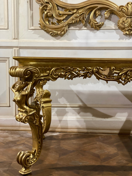 Dining table inspired by Louis XIV antiquity with caryatids.
