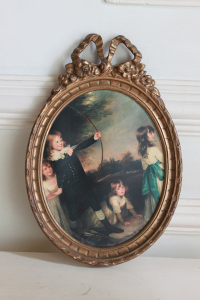 Frame in oval shape from The Unfurling with delicate ribbon