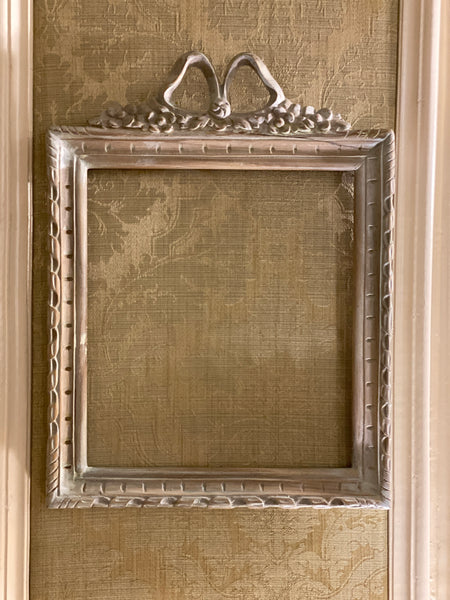 Frame in square shape from The Unfurling with delicate ribbon