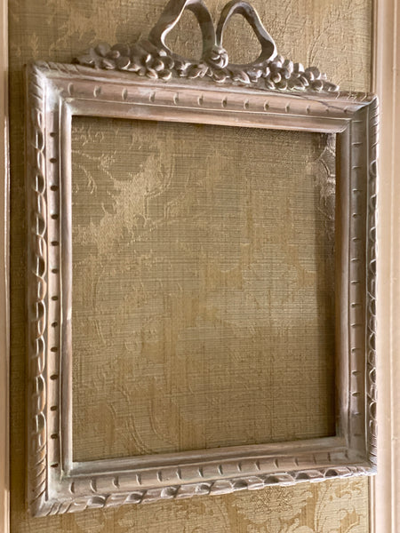 Frame in square shape from The Unfurling with delicate ribbon