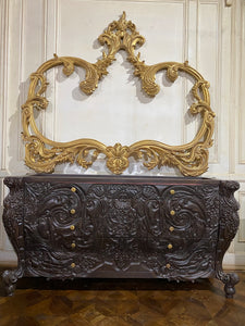 Surreal bombé commode with dramatic rococo scrolls