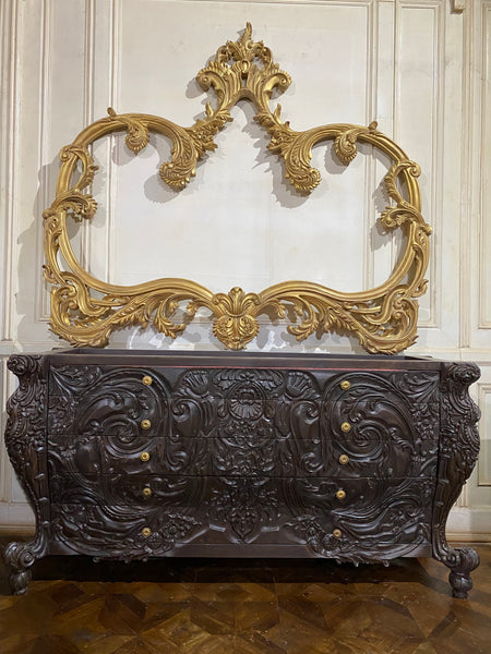 Surreal bombé commode with dramatic rococo scrolls