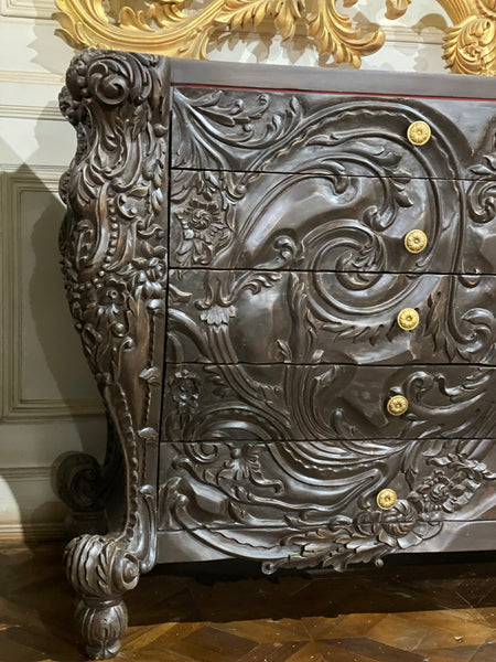 Surreal bombé commode with dramatic rococo scrolls
