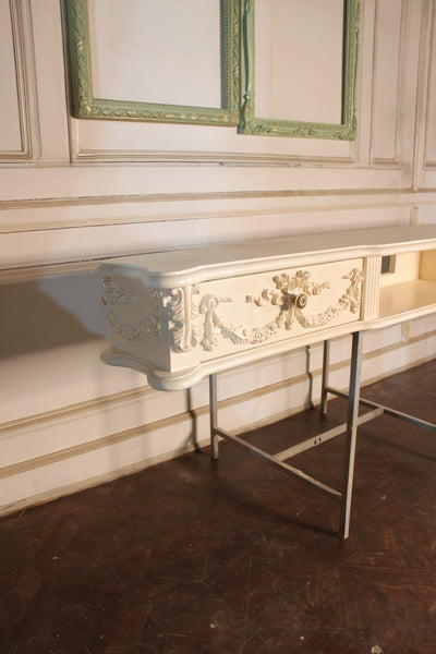 Floating media shelf with wreaths and ribbons inspired by The Unfurling