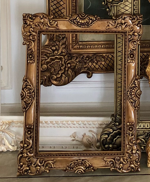 Frames of oversized proportions and rococo elements inspired by Louis XV