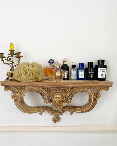 Console shelf with gilded mask