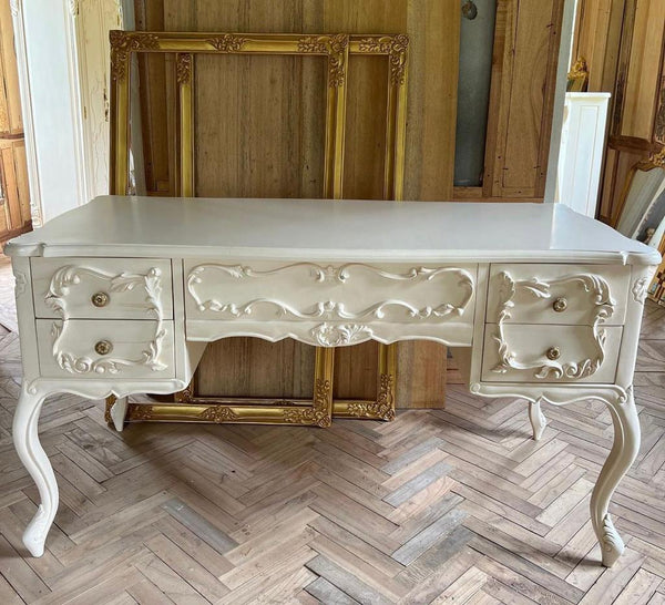 Rococo desk / dresser with exuberant scrolls