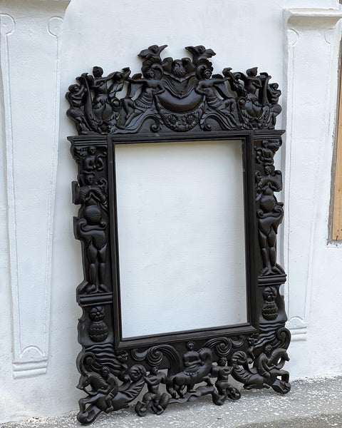 Renaissance frame with arabesques, angels, birds and grotesques